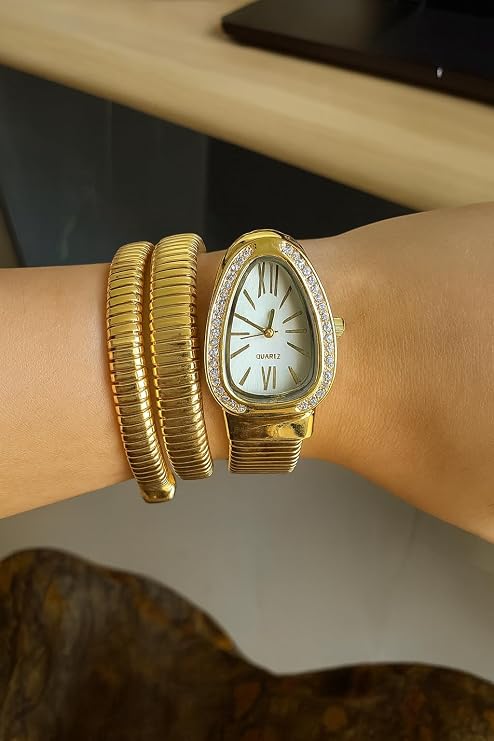 Women's gold snake wrap watch worn on wrist